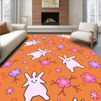 Whimsical Pink Bunnies Purple Flowers Orange Background Rug